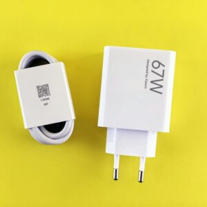 67W charger and cable set on a vibrant yellow background, showcasing charging technology.